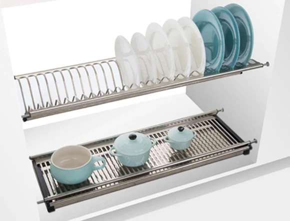 A sleek, stainless steel dish rack organized on a modern kitchen countertop.