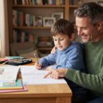 A supportive parent helping their child study at a desk, promoting a calm and productive learning environment.